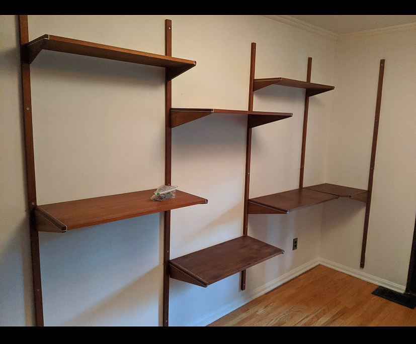 In this home office, I mounted these vintage shelves, which have to be precisely spaced in order to attach to the rails.