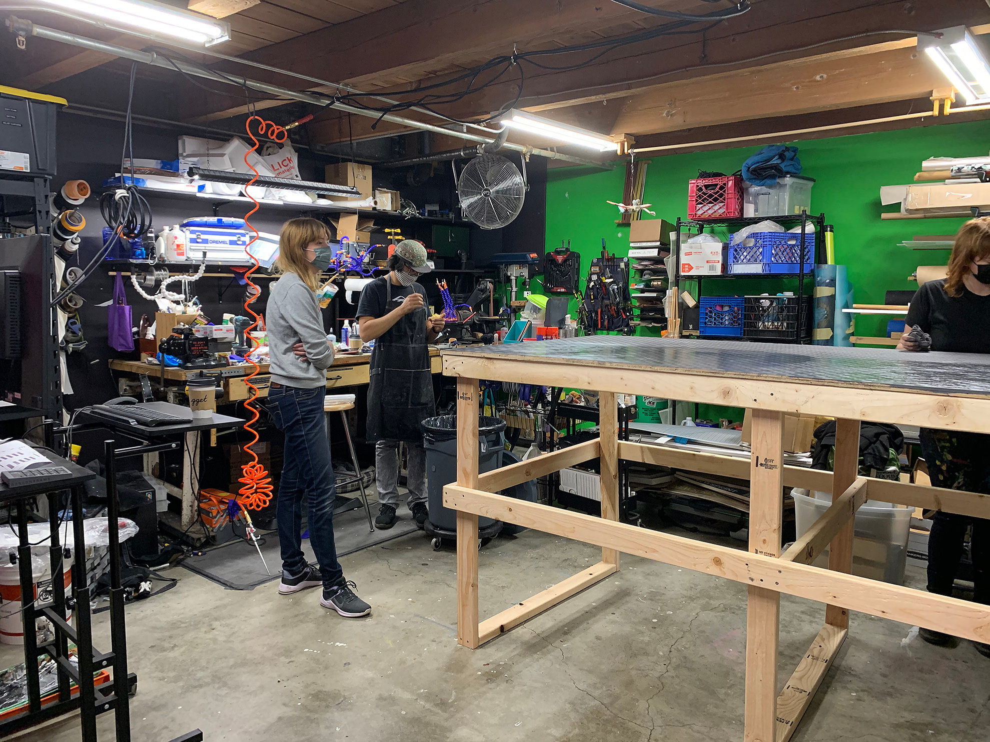 Tiffany, Eric, and Ange Cox aging the stage floor