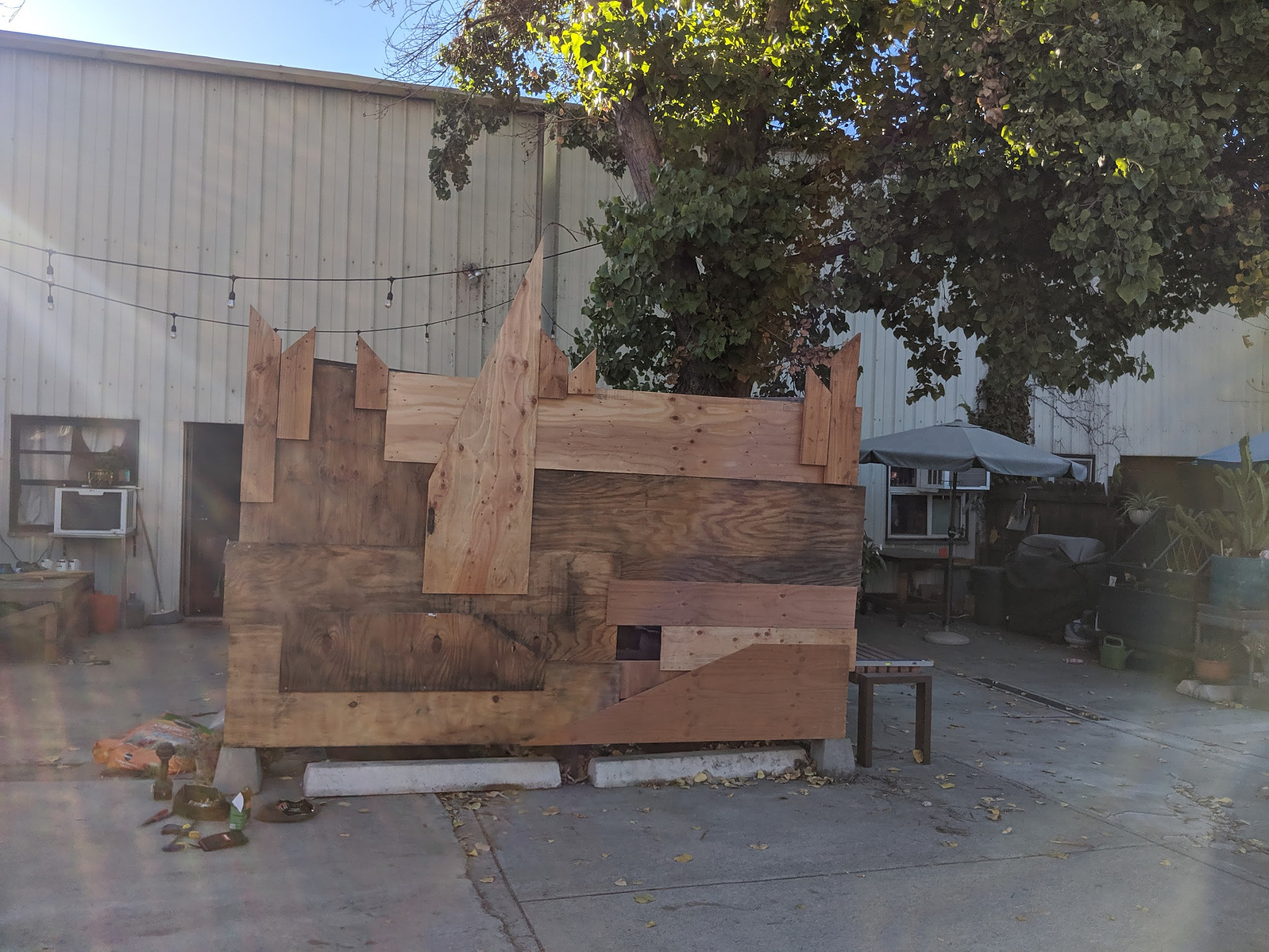 I built this fence from scrap wood and found objects.