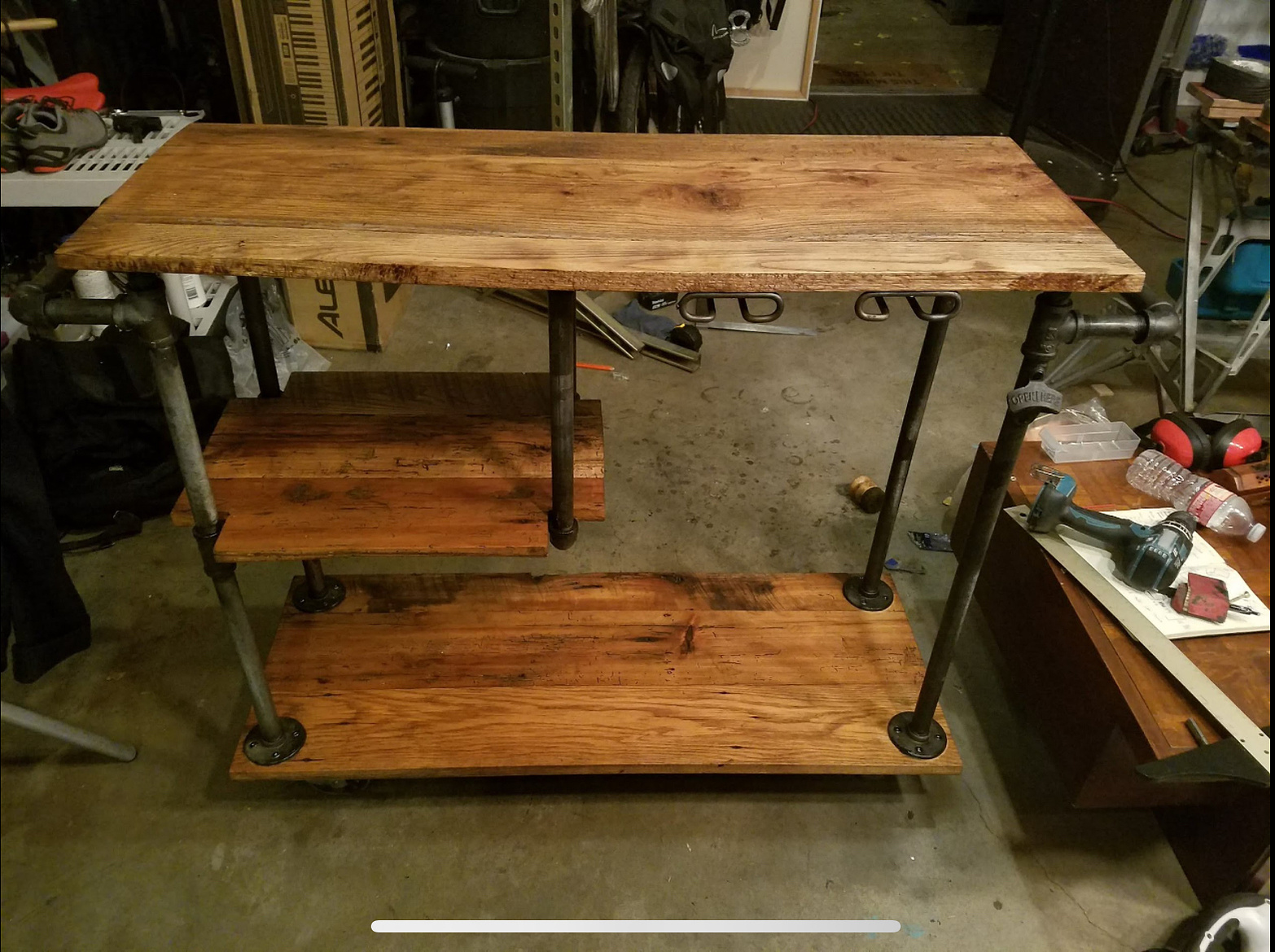Custom bar cart made from reclaimed Michigan barn wood. Pipes were custom cut, aged in acid, oil-quenched, and waxed.