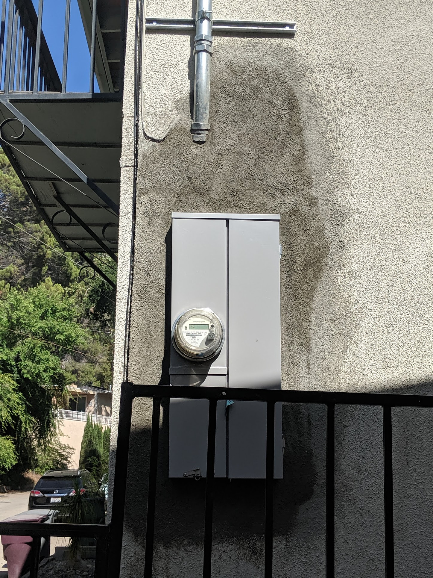 I patched the stucco around this electrical box, making sure to use the proper weatherproofed backing. Stucco is still drying in this photo.