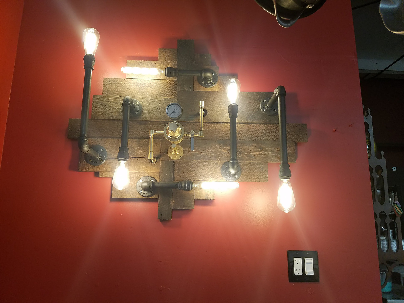 Completed light fixture installed on wall.